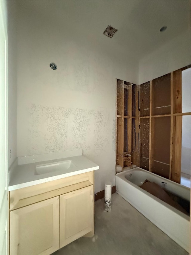 bathroom with vanity and a bathing tub