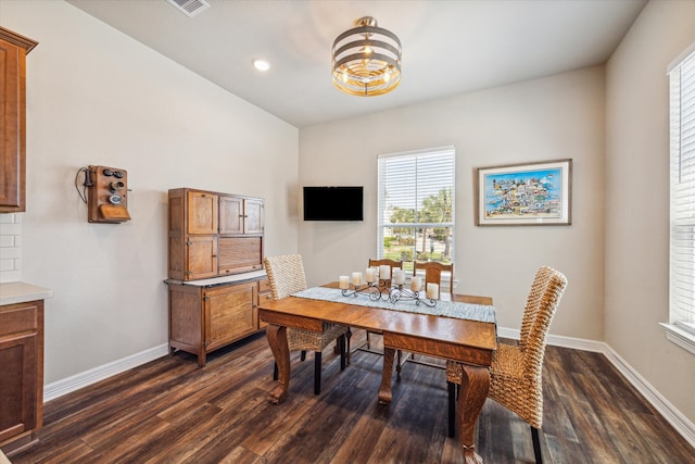 dining area with dark hardwood / wood-style flooring