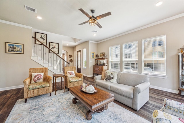 living room with ceiling fan, ornamental molding, and hardwood / wood-style flooring