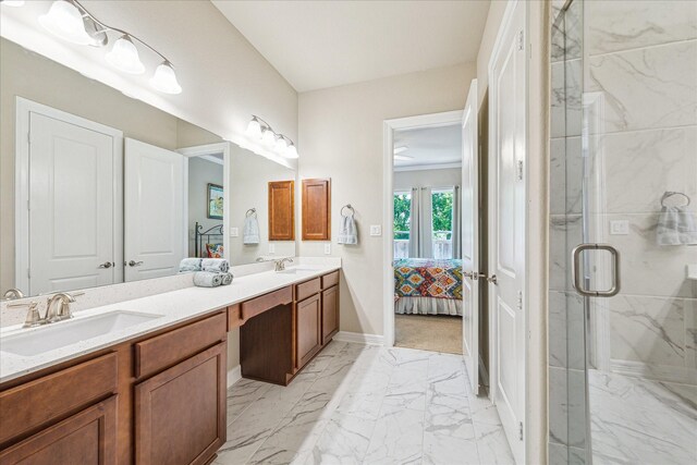 bathroom featuring vanity and a shower with door