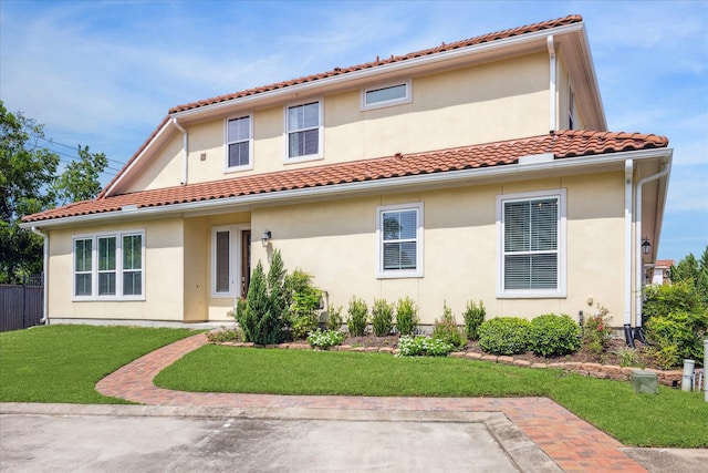 rear view of property with a patio area and a yard