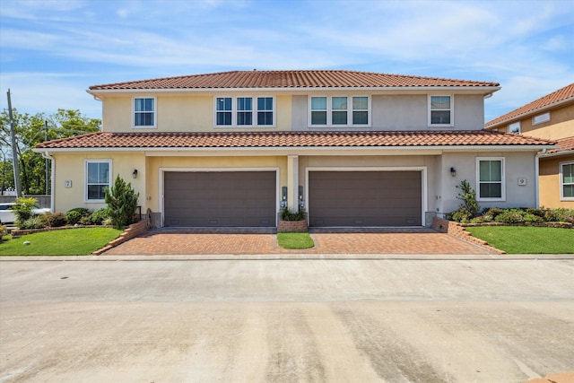 mediterranean / spanish-style home featuring a garage