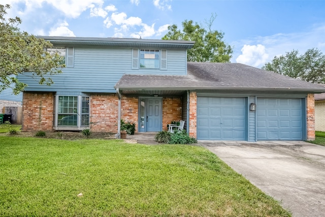 view of property featuring a garage and a front lawn