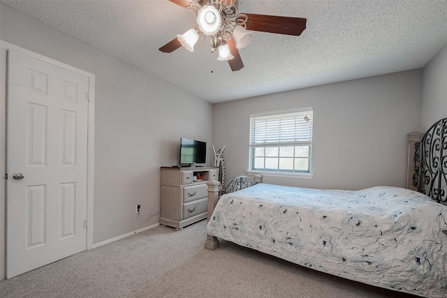 bedroom featuring a textured ceiling and ceiling fan