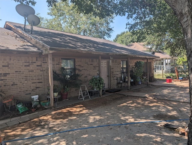 rear view of house featuring a patio