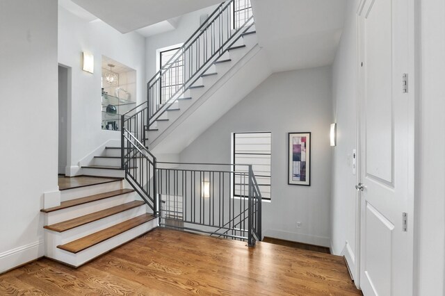 stairs featuring hardwood / wood-style flooring