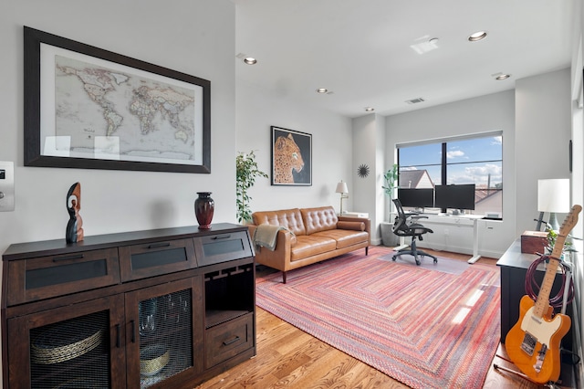 living room with light hardwood / wood-style floors