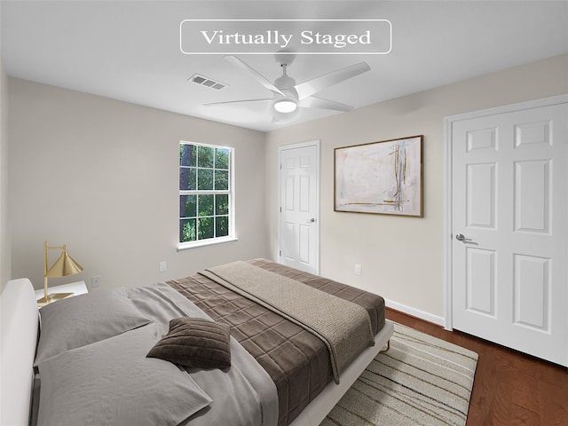 bedroom with ceiling fan and wood-type flooring