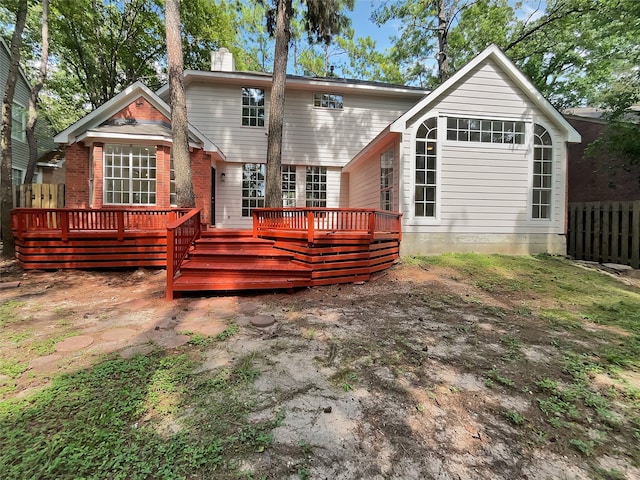 back of house featuring a deck