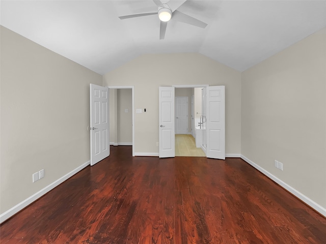 unfurnished bedroom featuring ceiling fan, hardwood / wood-style floors, and vaulted ceiling