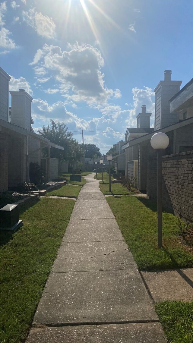 view of home's community with a yard