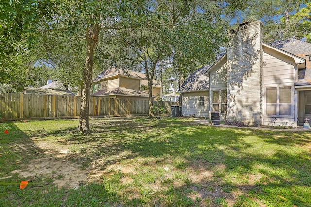 view of yard with central AC