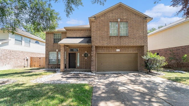 front of property featuring a garage and a front lawn