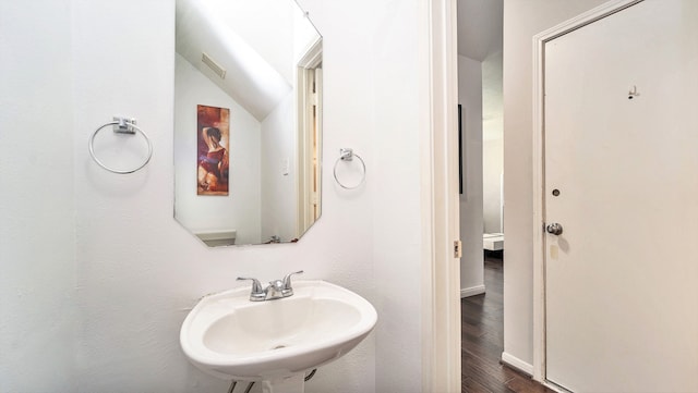 bathroom with hardwood / wood-style floors and sink