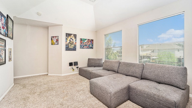 living room with lofted ceiling and carpet floors