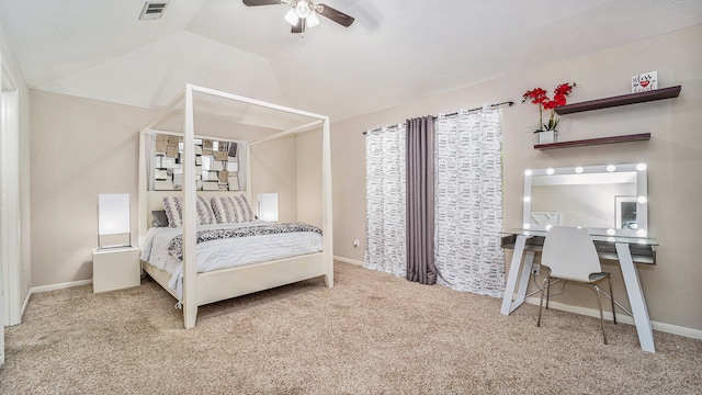 bedroom with lofted ceiling, ceiling fan, and carpet flooring