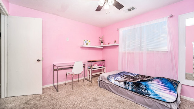 bedroom with ceiling fan and light carpet