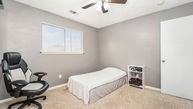 bedroom with ceiling fan and light colored carpet