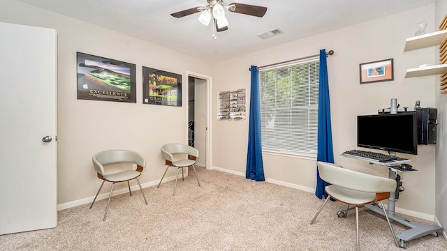 home office with light carpet and ceiling fan