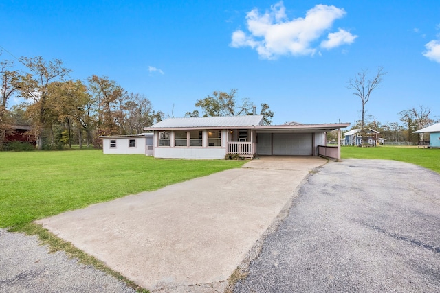 ranch-style house featuring a front yard and a carport