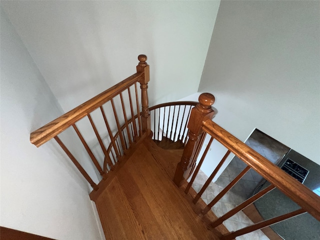 staircase featuring hardwood / wood-style floors