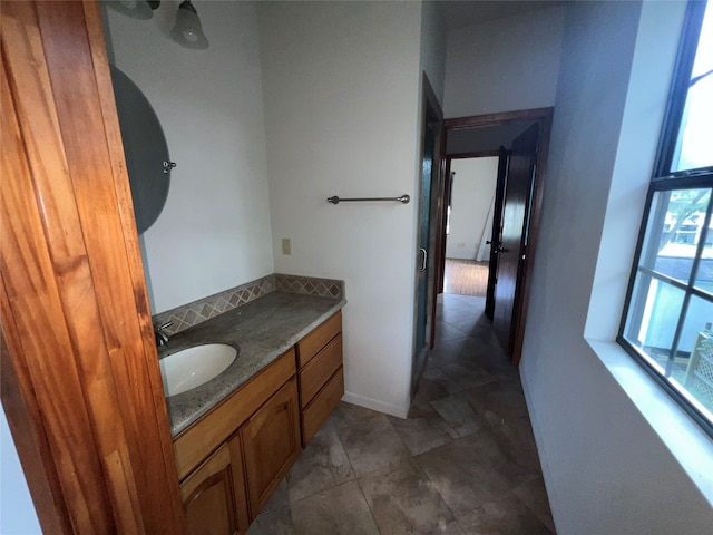 bathroom featuring tile patterned flooring and vanity