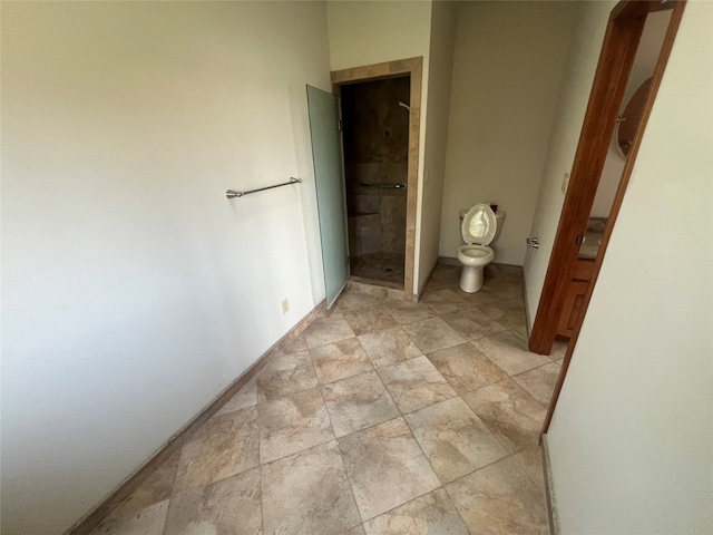 bathroom featuring tile patterned flooring and toilet