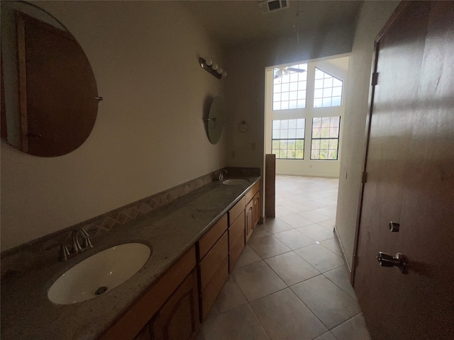 bathroom featuring tile patterned flooring and vanity