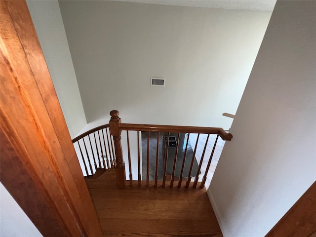 stairway featuring hardwood / wood-style floors