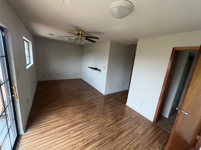 spare room featuring ceiling fan and light hardwood / wood-style floors