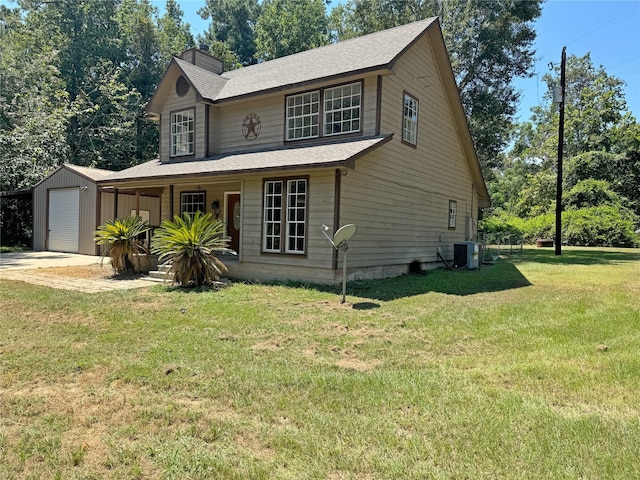 view of front of property featuring covered porch, a front lawn, an outbuilding, central AC, and a garage