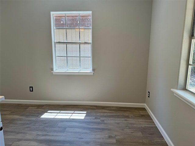 empty room featuring dark hardwood / wood-style flooring