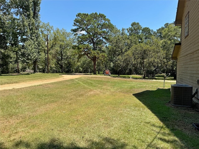 view of yard featuring central air condition unit