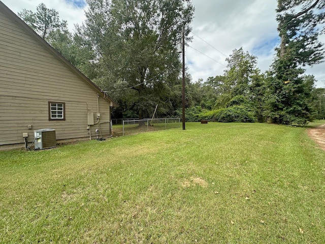 view of yard featuring central air condition unit