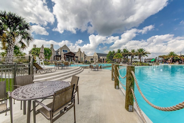 view of swimming pool with a patio