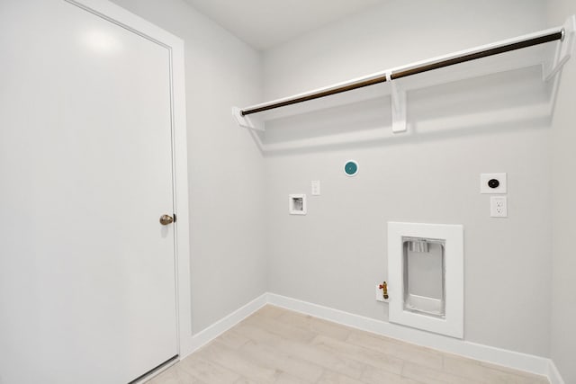 clothes washing area featuring electric dryer hookup, gas dryer hookup, and hookup for a washing machine