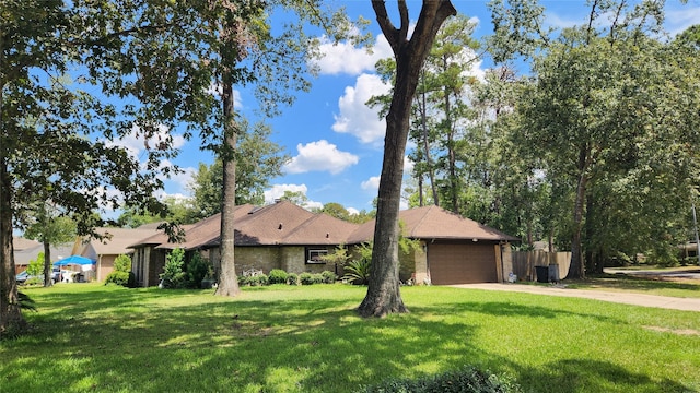 single story home with a garage and a front lawn