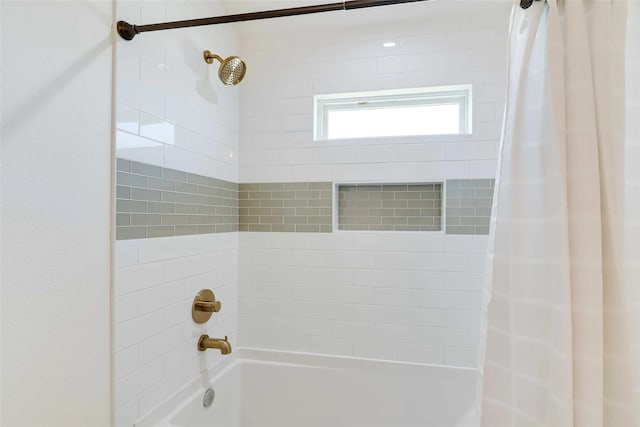 bathroom with shower / bathtub combination with curtain