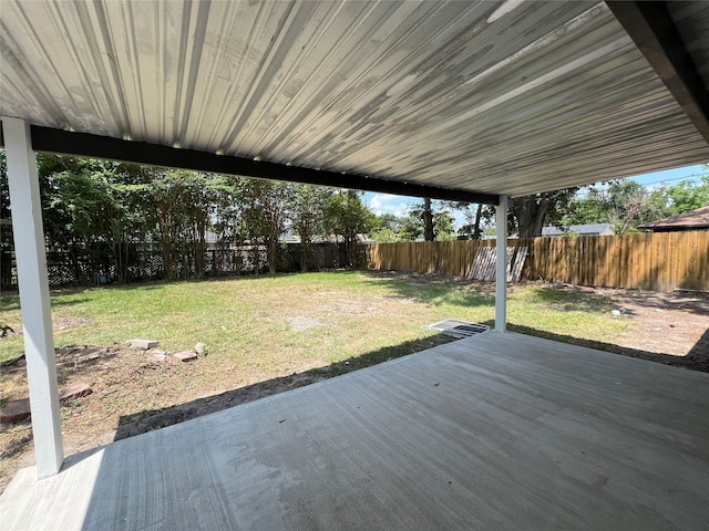 deck with a patio and a yard