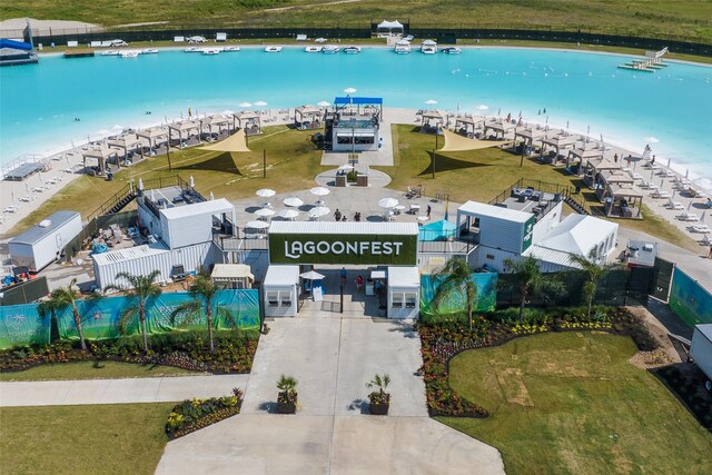 birds eye view of property featuring a view of the beach and a water view