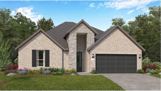 view of front of home with a front yard and a garage