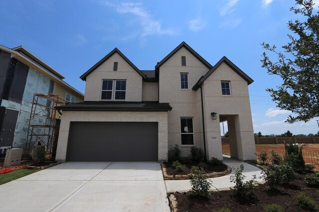 view of front of property with a garage