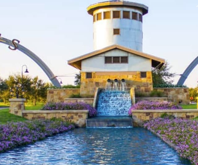 surrounding community featuring a water view