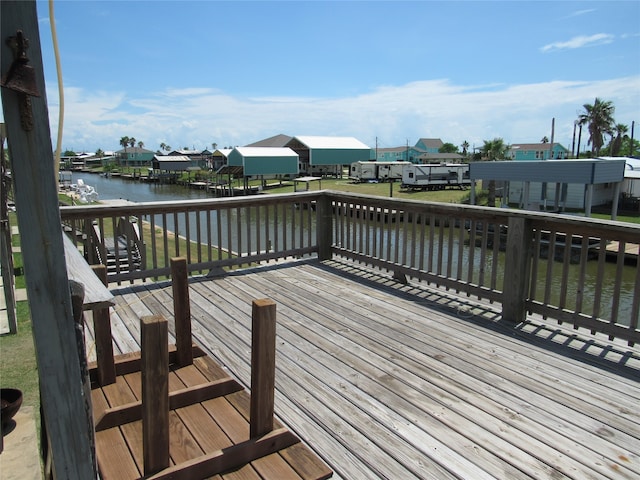 wooden deck with a water view