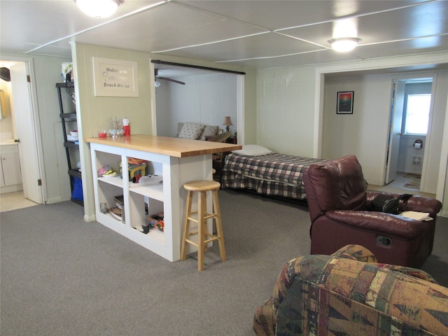 carpeted bedroom featuring ensuite bathroom