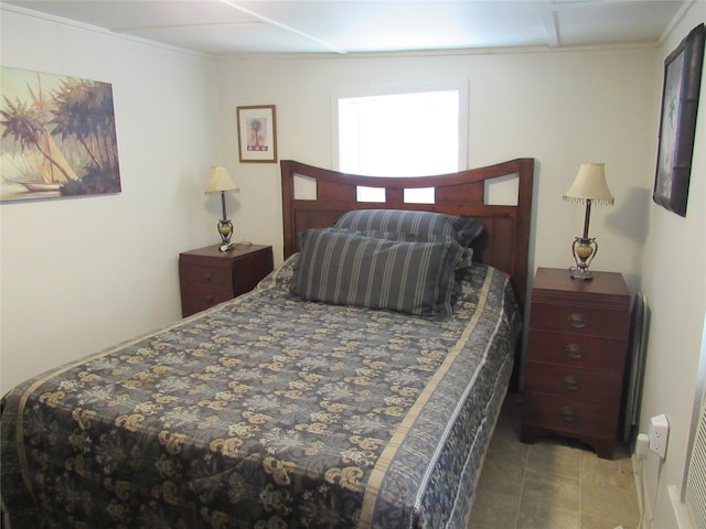 bedroom featuring light tile patterned flooring