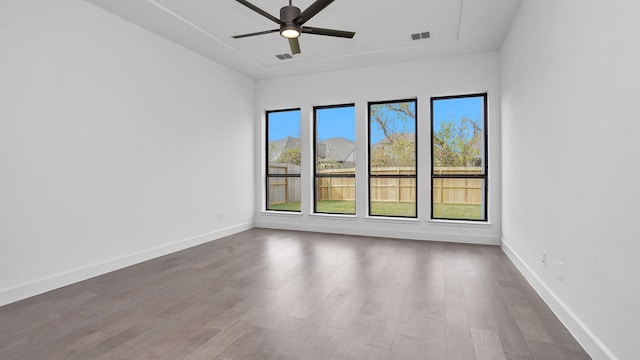 unfurnished room featuring ceiling fan and wood-type flooring