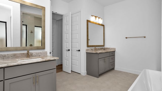 bathroom with tile patterned flooring, vanity, and separate shower and tub