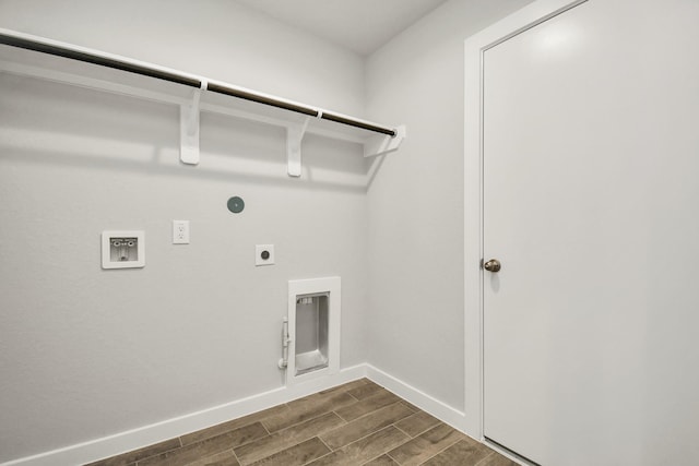 laundry area with hookup for an electric dryer, wood tiled floor, laundry area, hookup for a washing machine, and gas dryer hookup