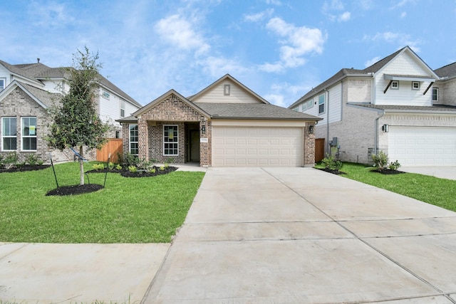 view of front of home featuring an attached garage, concrete driveway, a front yard, and brick siding